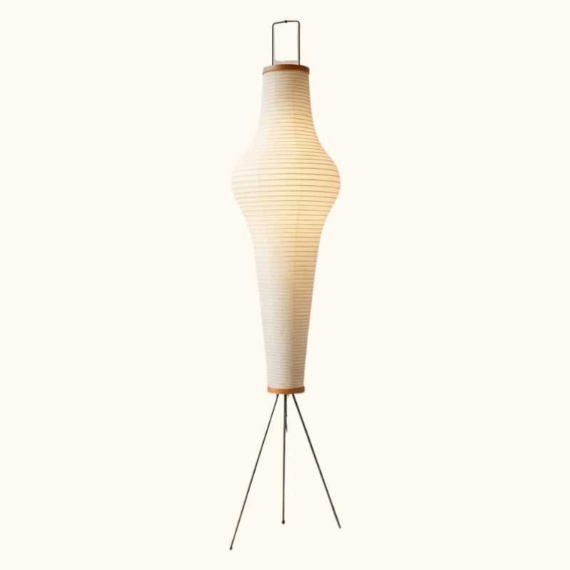Classic akari paper lamp with tall tapered rice paper shade wooden accents and wire tripod base displayed on clean white background