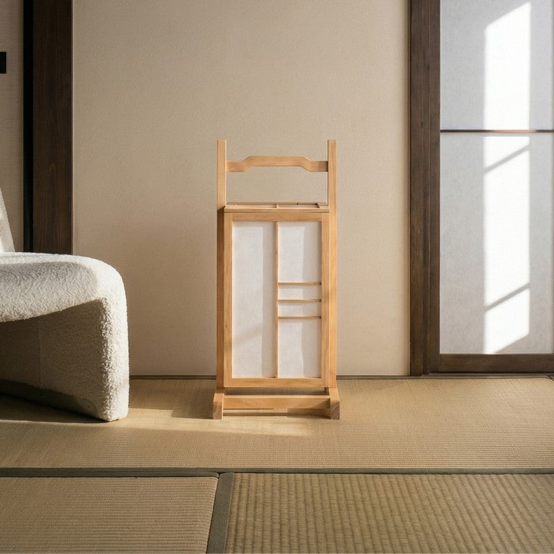 Authentic bamboo lamp with traditional shoji design positioned on tatami mat floor beside cream futon in serene Japanese interior setting