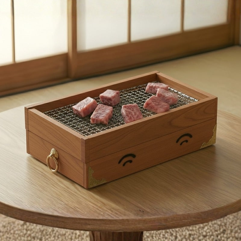 Authentic bbq grill japanese in cedar wood box with gold corners and wagyu beef on steel mesh grate