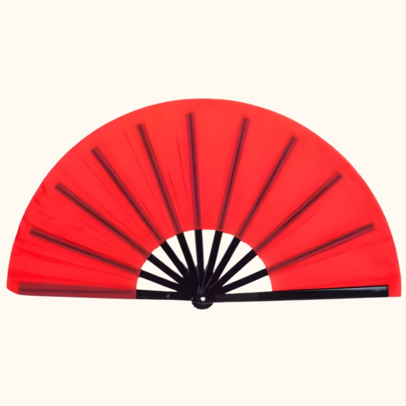 Large big red japanese fan with black bamboo frame and white center displayed on clean neutral background showing traditional craftsmanship