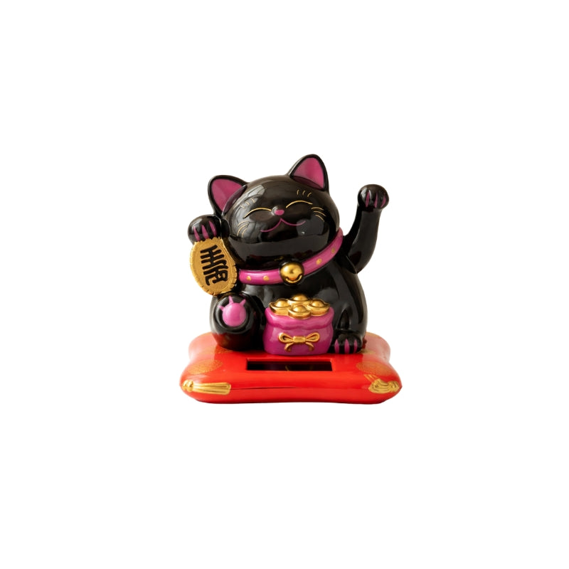 Protective black maneki neko cat japanese with pink accents and golden coin holding both paws raised on red solar base against clean white background