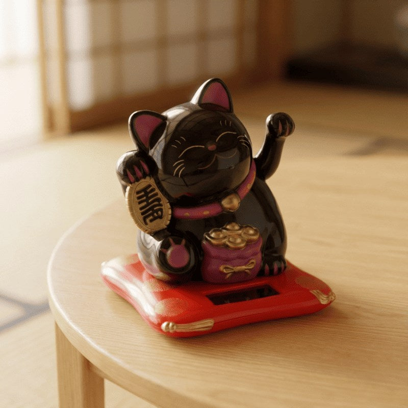 Lucky black maneki neko cat with waving paws and fortune coin sitting on red base atop round wooden stool in minimalist natural light interior