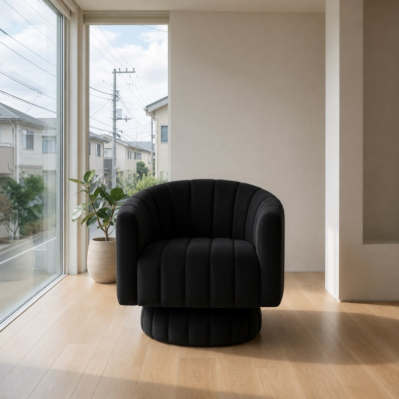 Black sofa japanese floor with rounded bubble upholstery on light wood near window overlooking residential neighborhood