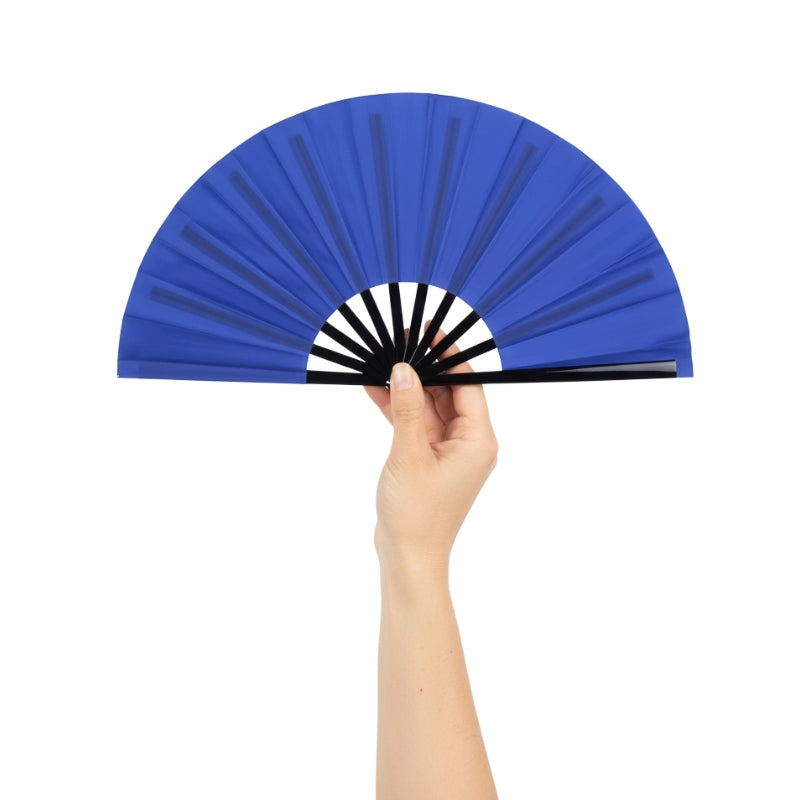 Graceful blue fan japanese held in hand against white backdrop showcasing deep cobalt color and traditional folding structure
