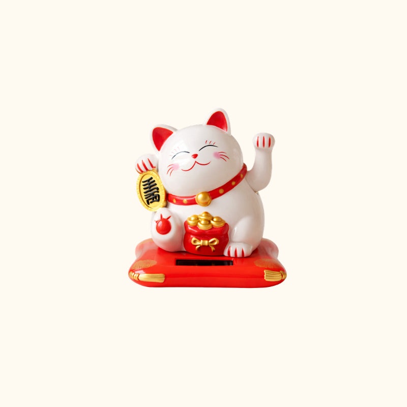 White Cat Japanese Maneki Neko lucky cat with raised paws, gold coin, red money bag and decorative red base