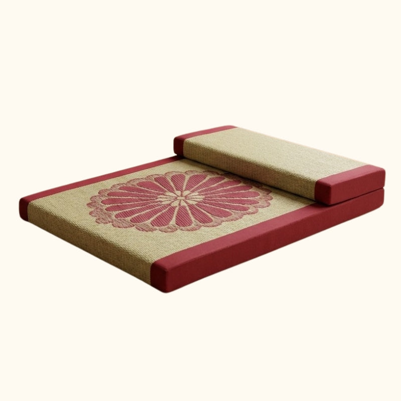 Floor meditation cushion with beige tatami surface burgundy borders chrysanthemum embroidery pattern and backrest pillow on white background
