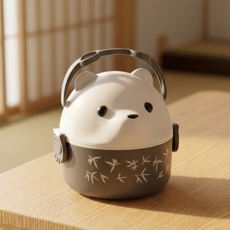 Stackable cute bento box featuring white bear face and bamboo engravings on wooden table in natural light