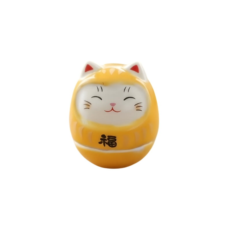 Yellow daruma lucky cat japanese with smiling white face red ear details and fortune kanji on clean background