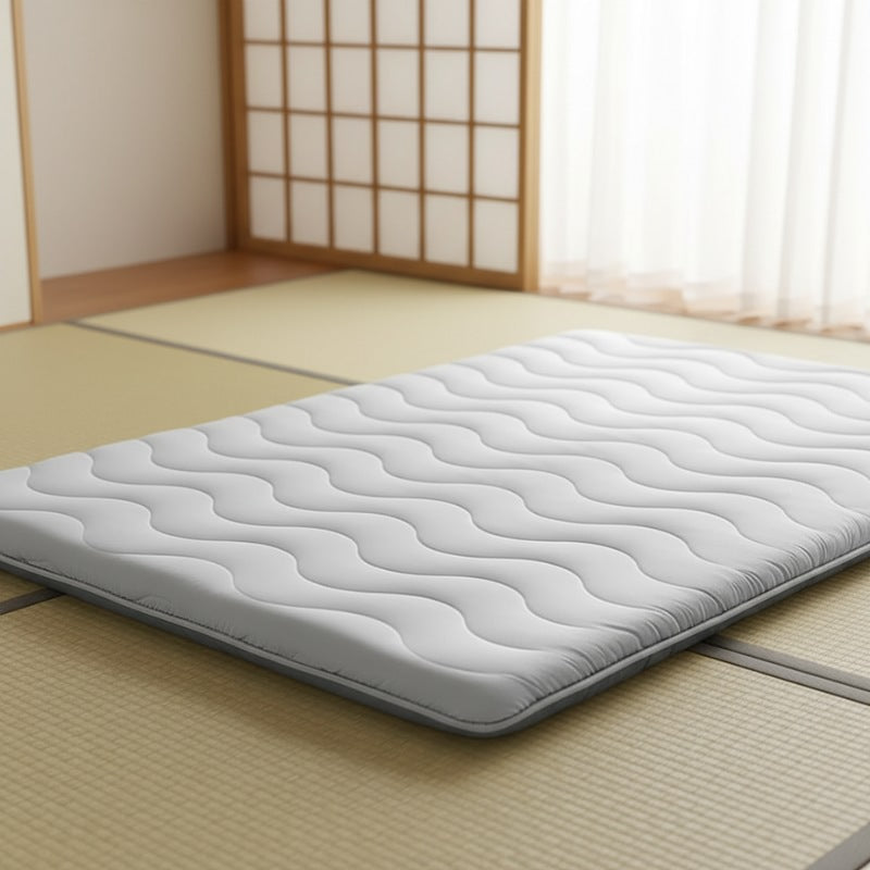 Close up detail of futon japanese with elegant wave pattern stitching on tatami mat floor near shoji sliding doors in minimalist setting