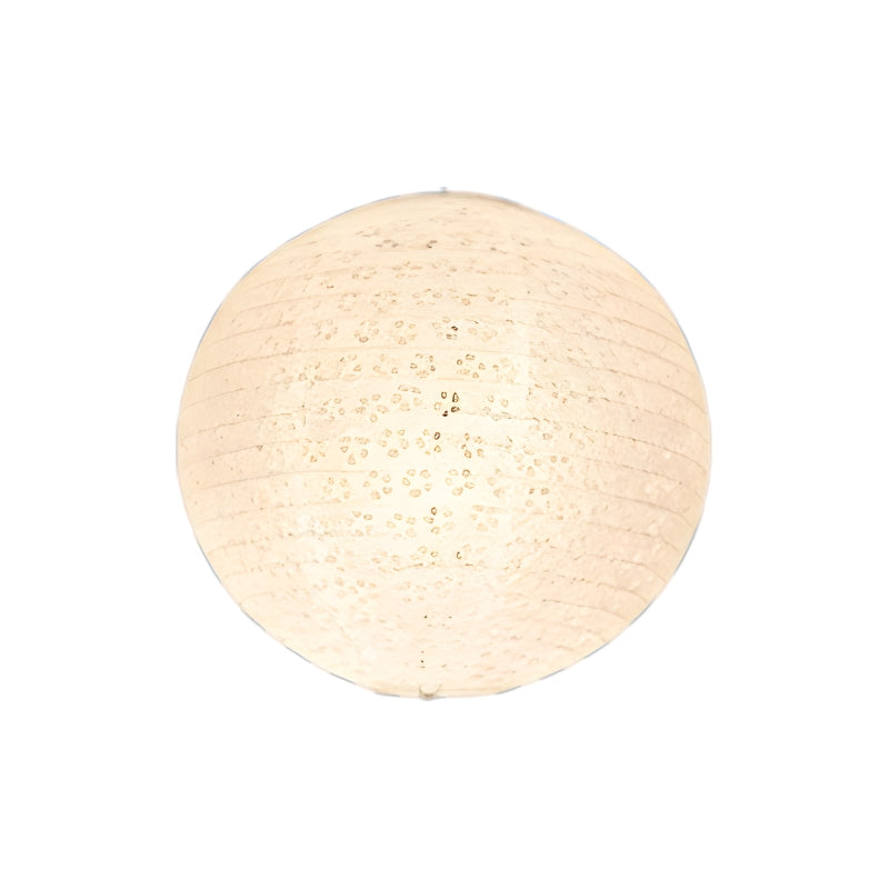 Spherical hanging japanese lantern white with delicate perforated pattern and washi paper displayed on clean neutral background