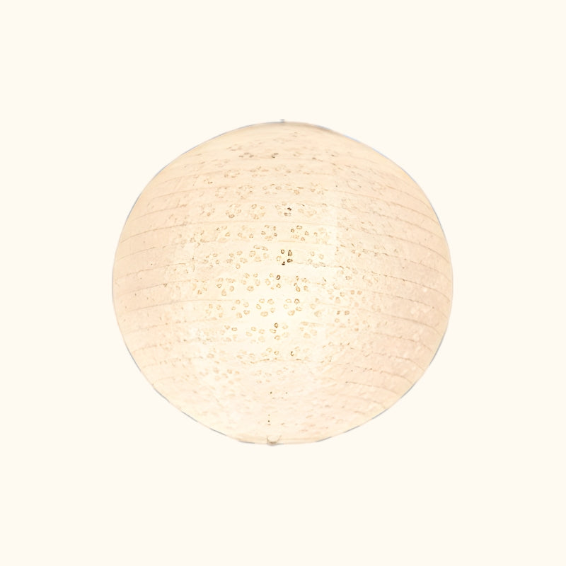 Spherical hanging japanese lantern white with delicate perforated pattern and washi paper displayed on clean neutral background