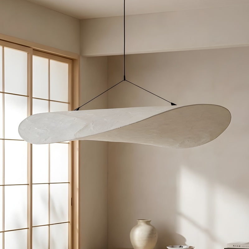 Modern japandi pendant lamp with flowing wood design near traditional shoji screen in zen interior