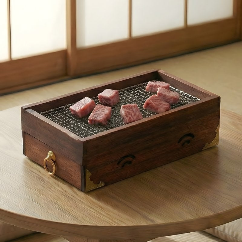 Japanese charcoal barbecue wooden box grilling premium beef cuts on mesh surface with ventilation holes and brass hardware