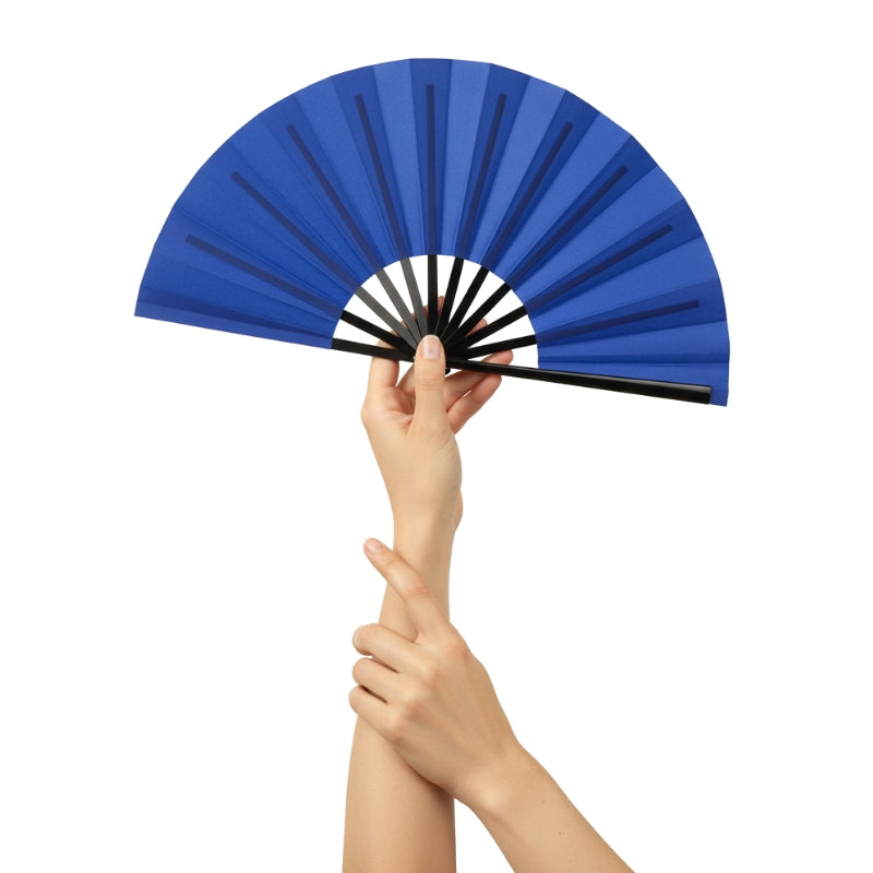 Beautiful japanese fan blue with gradient navy shades held delicately with both hands against minimalist white background