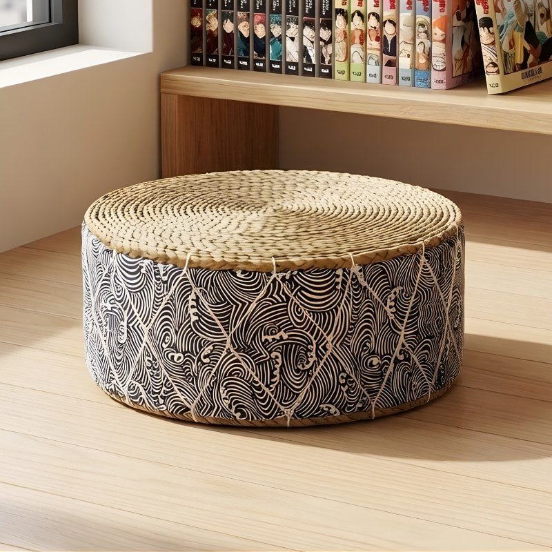 Japanese floor seating cushion with rattan woven top and seigaiha pattern beside shelf with manga collection