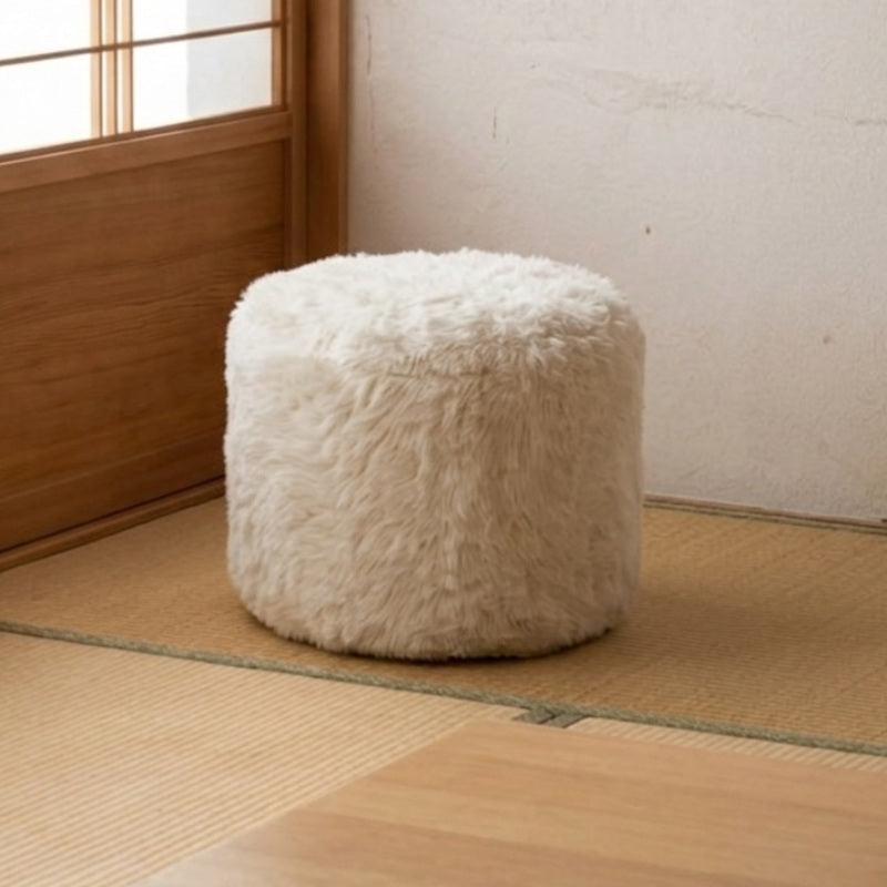 Japanese low sofa pouf in cream shaggy fur fabric placed on a tatami mat floor near a wooden shoji sliding door