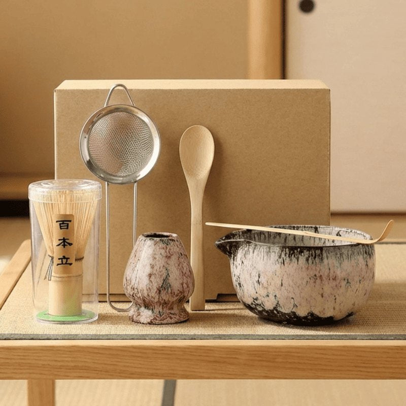 Soft pink matcha tea set with textured glaze arranged on wooden table with tatami mat in traditional Japanese interior