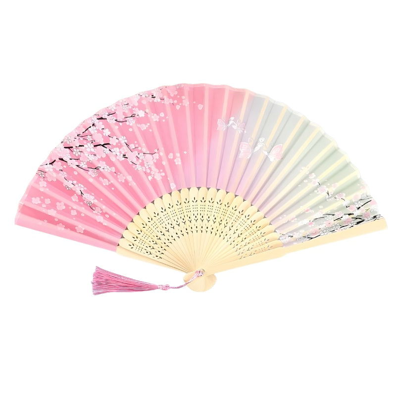 Elegant japanese pink hand fan with cherry blossom pattern gradient colors and natural bamboo frame with pink tassel on clean white background