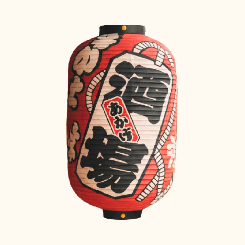 Classic japanese red paper lanterns with izakaya calligraphy displayed on clean white background showcasing traditional chochin design