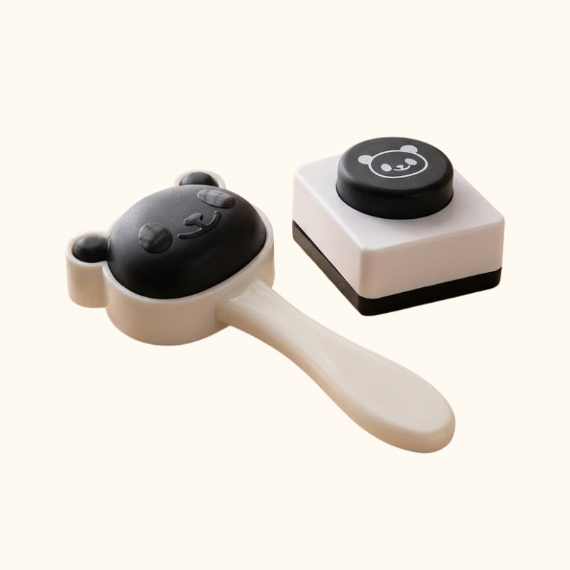 Cute maker sushi rice set with panda-themed press and handle mold on clean white background