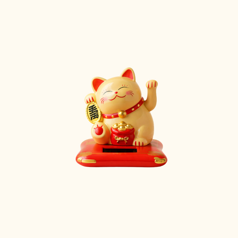 Cream Maneki Neko Cat Japanese lucky cat with raised paws, gold coin, red money bag and decorative red base