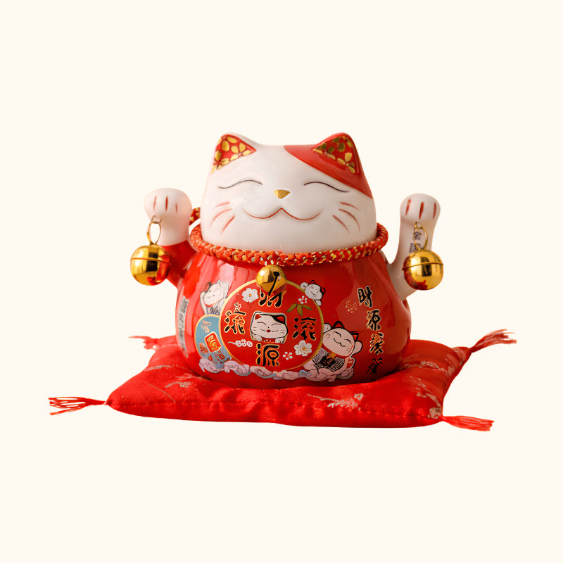 Red Maneki Neko Statue Japanese lucky cat with raised paws, golden bells and traditional prosperity symbols