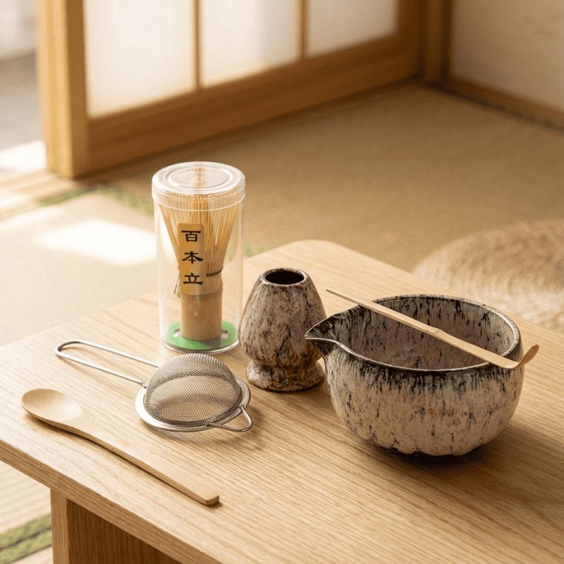 Cream and brown matcha tea set japanese variation with textured ceramic pieces resting on tatami floor in golden afternoon light