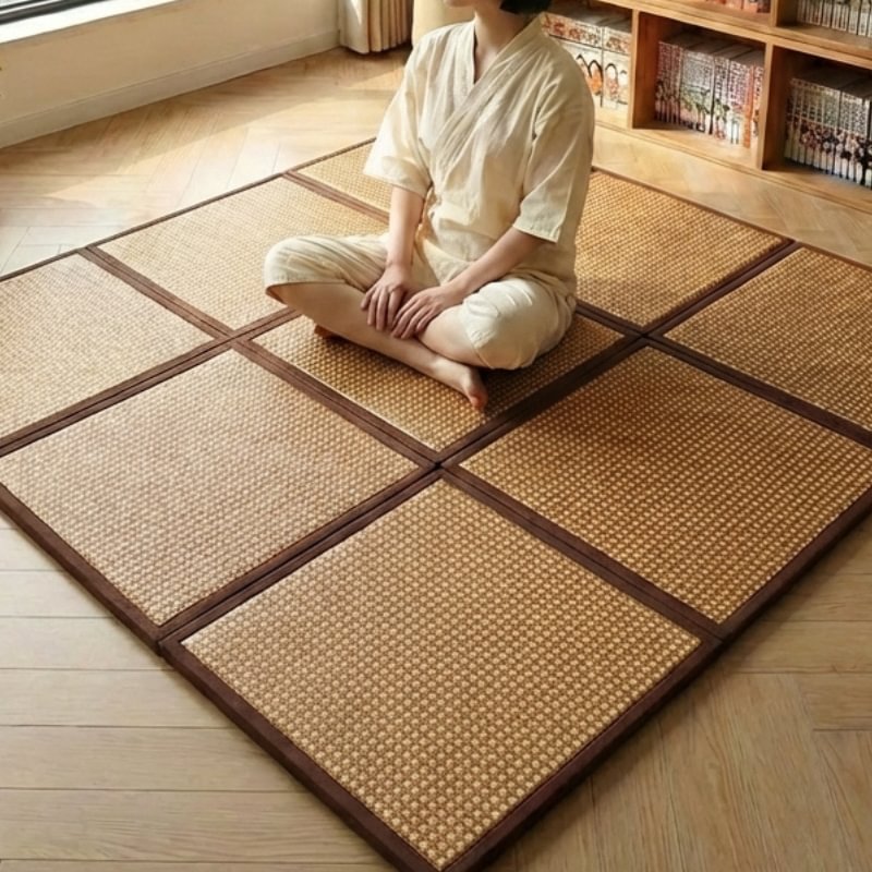 Mattress japanese tatami tiles with person sitting seiza position in white clothing near bookshelf with manga volumes