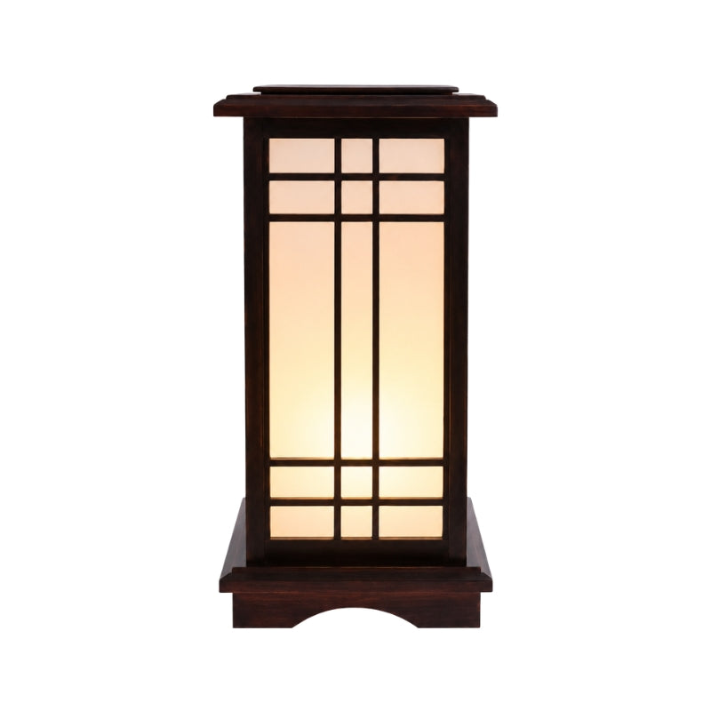 Mini Japanese shoji lamp in dark walnut wood with warm glowing rice paper grid panels and arched base displayed on white background