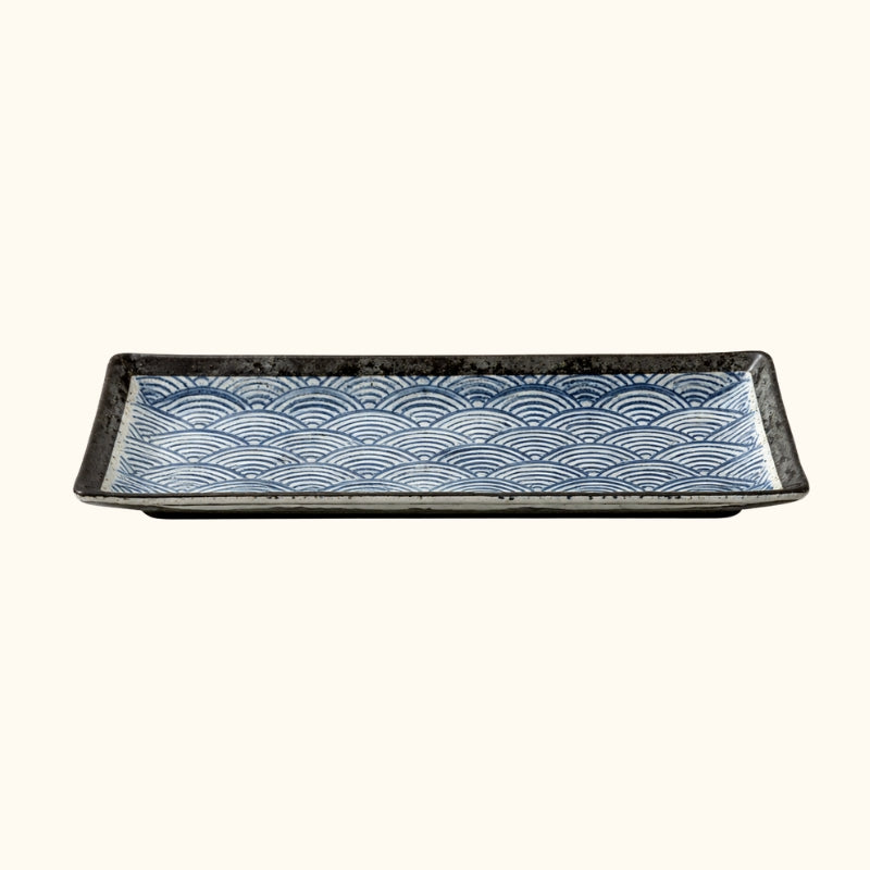 Premium plate sushi fancy with handpainted blue wave motifs and black ceramic frame on white background