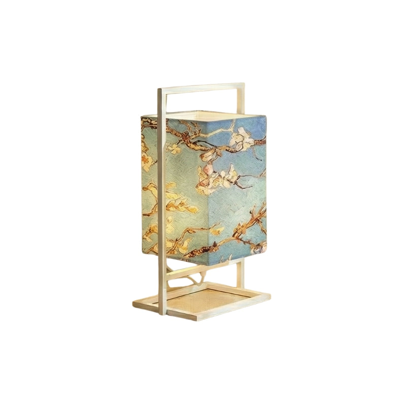 Classic style table lamp japanese featuring sakura branch design on blue fabric shade with white aluminum frame displayed on clean background