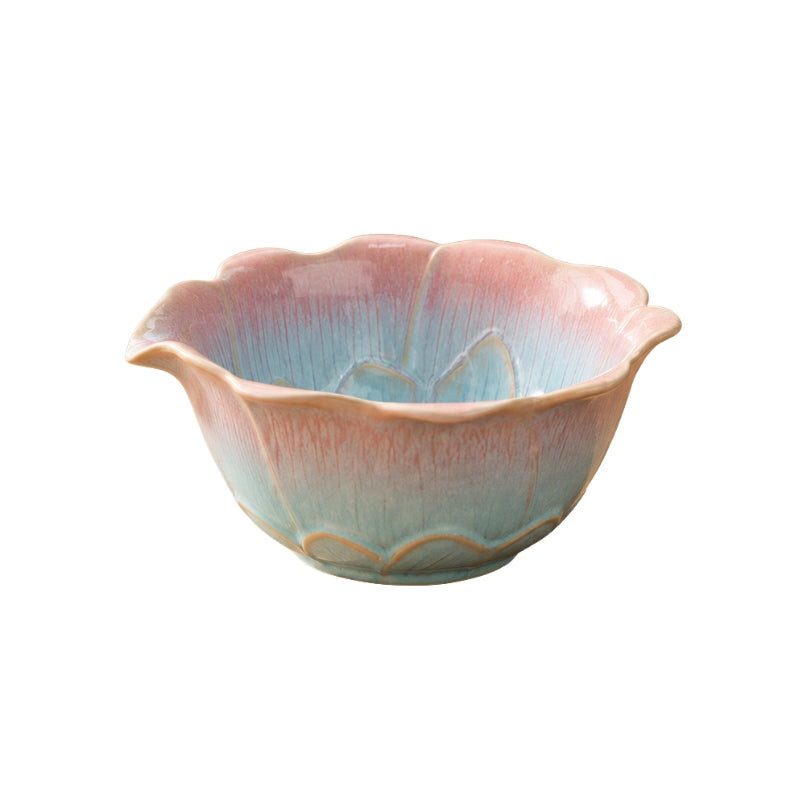 Ceramic tea bowl matcha style with scalloped lotus rim and pink-to-turquoise gradient glaze on white background
