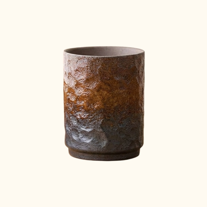 Tea cup japanese vintage style with textured gradient surface from warm rust to deep shadow tones