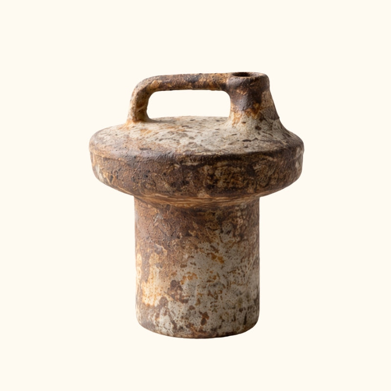 Authentic wabi sabi vase pottery displaying raw ceramic texture and natural imperfections on neutral background