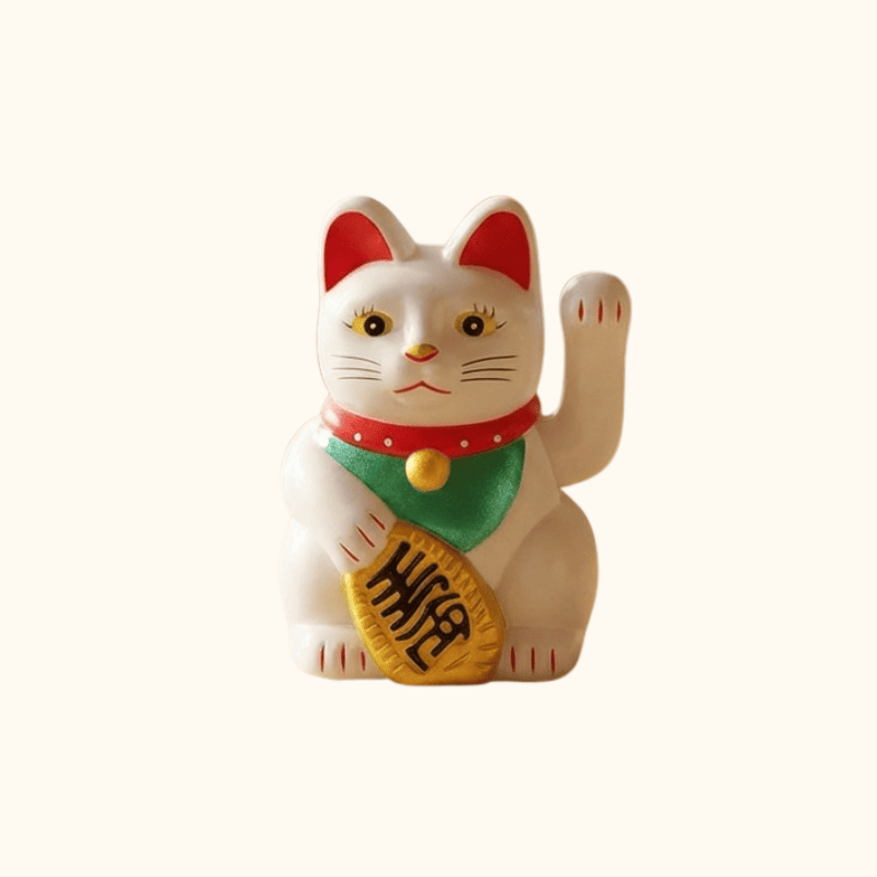 White wavin maneki neko japanese style with waving paw and treasure detail displayed on clean white background for product view