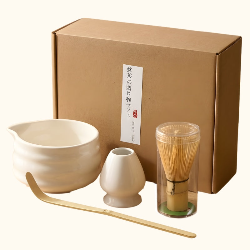 Complete whisk set matcha japanese with white ceramic bowl holder bamboo whisk scoop and kraft packaging on clean white background