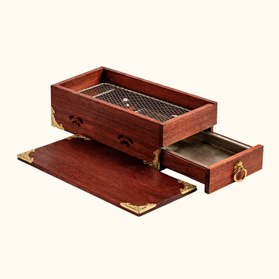 Barbecue Japanese charcoal grill in dark red wood with opened drawer showing storage compartment and brass corner decorations