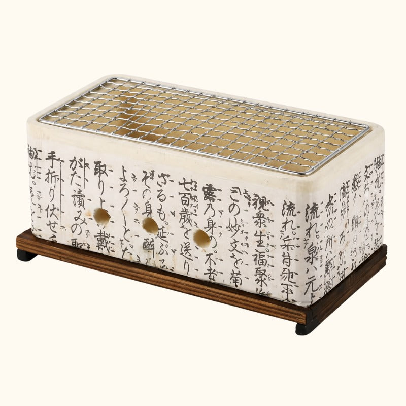 Barbecue white Japanese rectangular ceramic with black calligraphy and stainless steel mesh grate on natural wood platform