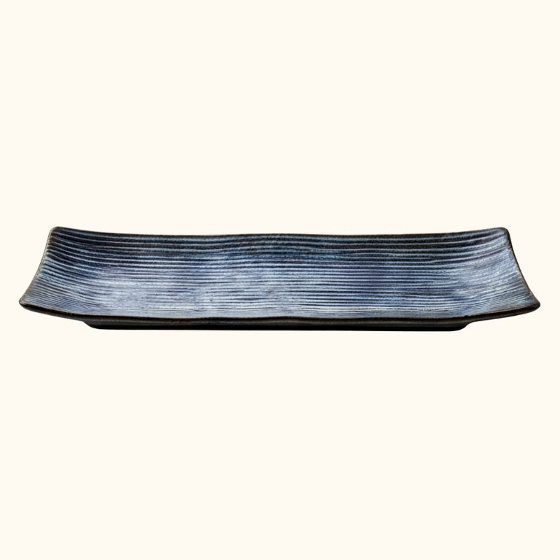 Contemporary blue plate of sushi with horizontal stripe texture in dark indigo ceramic finish