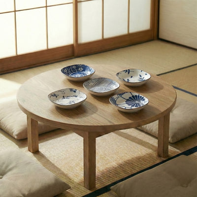 Bowls kobachi collection of five hand-painted ceramic dishes with wave and floral motifs on round wooden table in tatami room