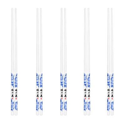 Set of 5 pairs of ceramic chopsticks in white with blue peony flowers and Asian calligraphy decoration, displayed on white background