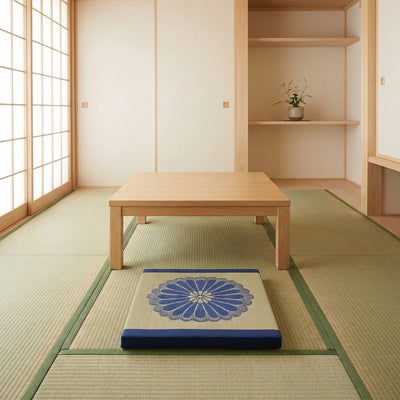 Cushion for meditation blue with chrysanthemum embroidery near chabudai table on tatami floor with shoji screen fusuma and tokonoma