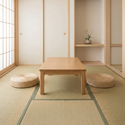 Japanese floor round cushion duo in natural rattan flanking chabudai table on tatami with fusuma doors and tokonoma alcove
