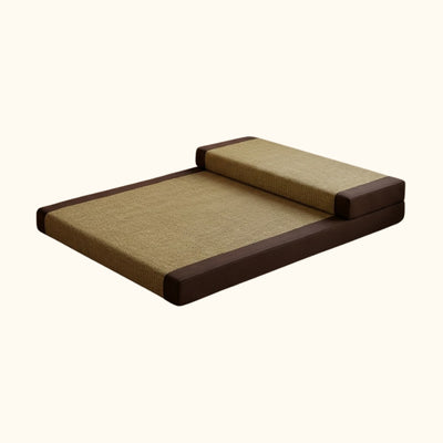 Japanese seating cushion with beige tatami surface brown borders and folded backrest on white background