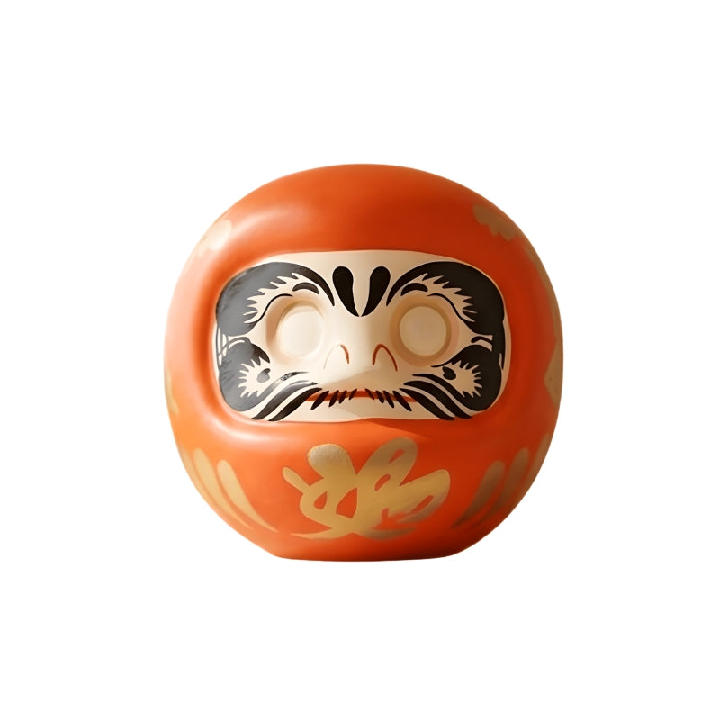 Glossy daruma orange in japanese style with fierce expression and blank eyes isolated on clean cream background for clear business goal tracking