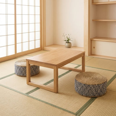 Japanese floor seat cushions with seigaiha wave pattern around wooden chabudai table on tatami mats with shoji screen
