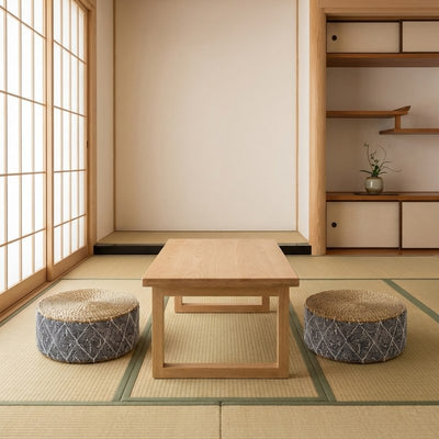 Floor seating japanese style with two zabuton cushions featuring geometric navy patterns on authentic tatami room with shoji doors