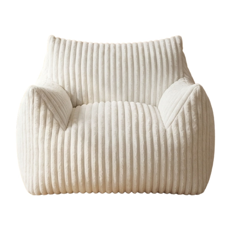 Floor sofa japanese armchair with white corduroy texture near window overlooking residential street with potted plant