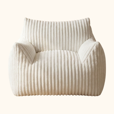 Floor sofa japanese armchair with white corduroy texture near window overlooking residential street with potted plant