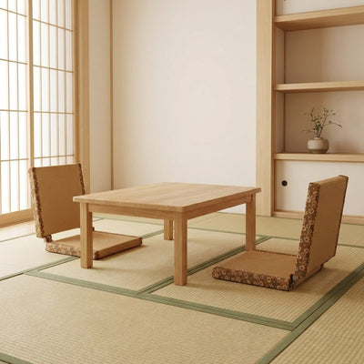 Floor tatami chair pair with brown woven surface and floral borders on tatami around low table in traditional interior